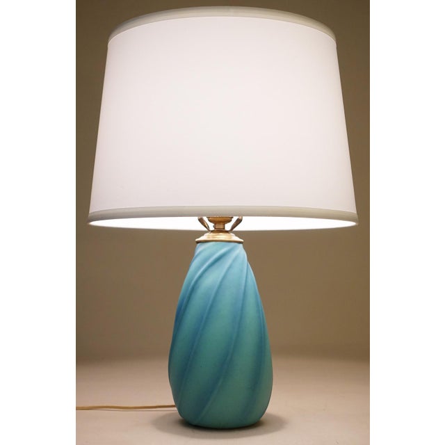 A visually dynamic and elegantly styled Art pottery sculpture Aqua Swirl glazed ceramic table lamp designed and produced...