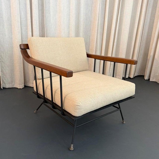 This striking Mid-Century Modern wrought iron lounge chair was designed by Richard McCarthy for Selrite circa the 1950s....