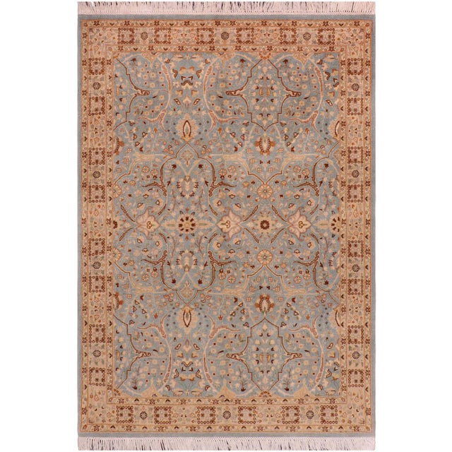 Designed with a mesmerizing intricate traditional motif this glorious hand knotted rug is a masterpiece that will fill any...