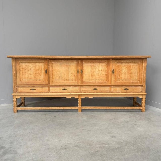 Remarks: Danish sideboard by Henning Kjaernulf, 1960s. Completely made of solid oak. Chest has nice details and is in a...
