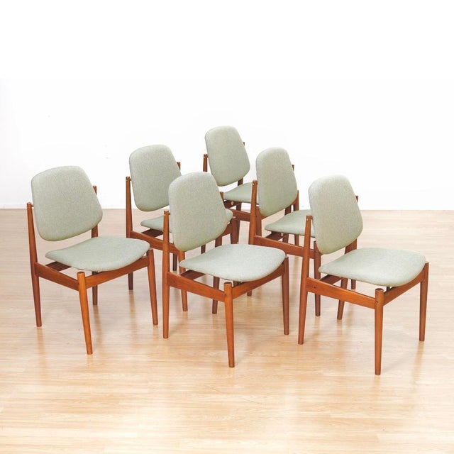 Set of six iconic Danish modern dining chairs designed by Arne Vodder for France & Son, showcasing the refined modernism...
