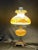 This is a beautiful vintage Fenton lamp! It is an elegant Gone-with-the-Wind style hurricane lamp with all of the original...