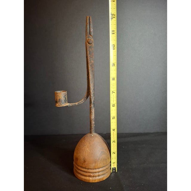 For sale is an 18th-century hand-forged wrought iron rushlight holder with an integrated candle socket counterweight, set...