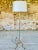 Beautiful, French, vintage floor lamp resting on tripod feet with gilded brass decor, from the 1960's - 70's. Piece...