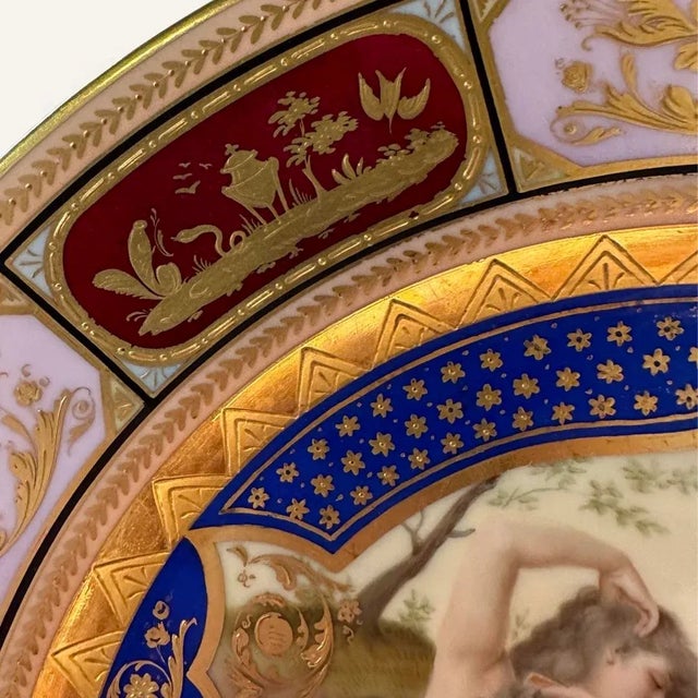 Beautiful Royal Vienna underglaze plate featuring a hand painted vignette of an exotic raven-haired beauty in a rocky...