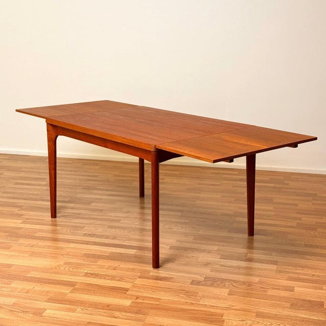 Dining table manufactured in Denmark in the 1950s-60s by Vejle stole- og møbelfabrik A/S. It is made of teak on the...