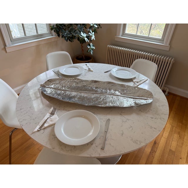 Some serving pieces disappear into the table. This one becomes the centerpiece. This Extra Extra Large Banana Leaf platter...