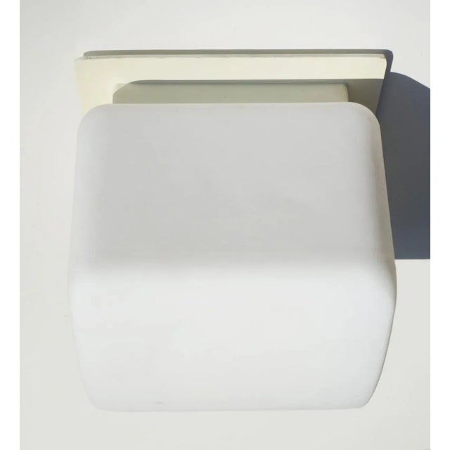 "Onda" wall lamp Claudio Salocchi 1969, Lumenform Modular lamp Murano opaline glass Lacquered metal base. This piece has...