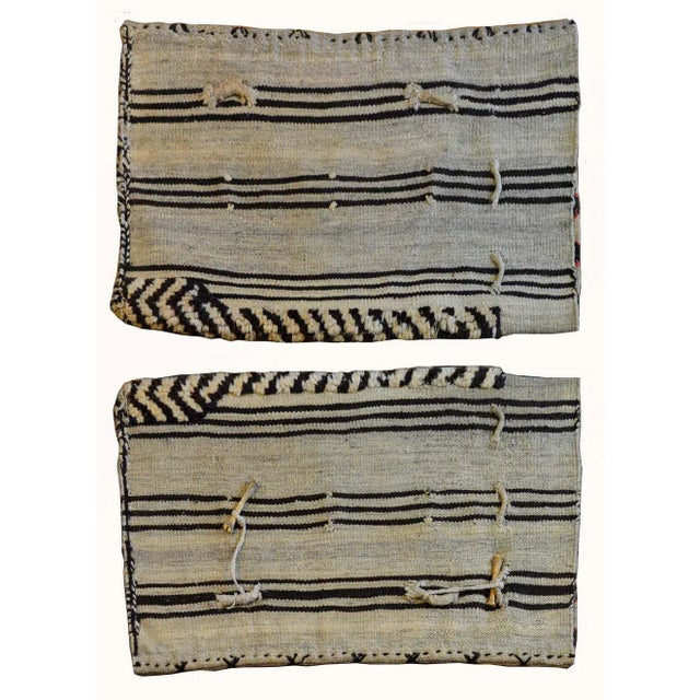A beautiful pair of early 20th century Persian Gabbeh grain bags, each with a wonderful geometric pattern containing...