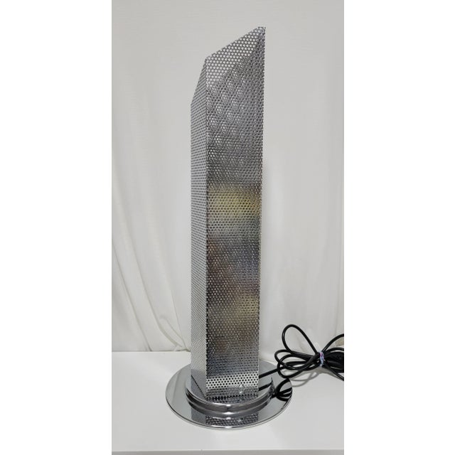 Tall Postmodern Skyscraper Table Lamp. Material is Stainless steel I believe. The base bottom is enameled metal. Rewired...