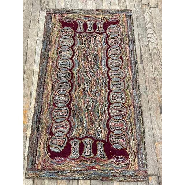 This is a delightful and highly authentic small antique American Hooked accent rug, dating back to circa 1880. Measuring a...