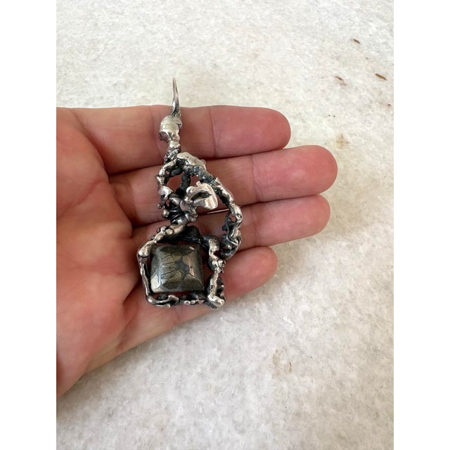 Handmade mid-century, modern Sterling silver brutalist pendant.
