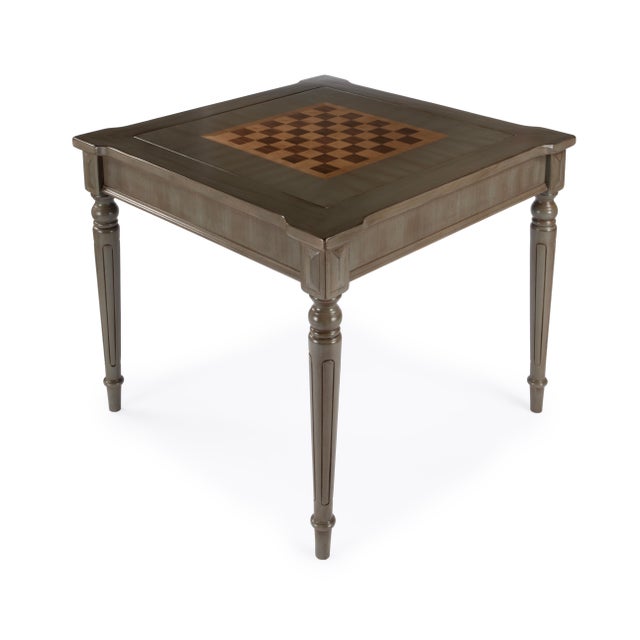 Play a variety of games on this stylish table that is veneered in a Silver Satin finish. The top inset has a game board...