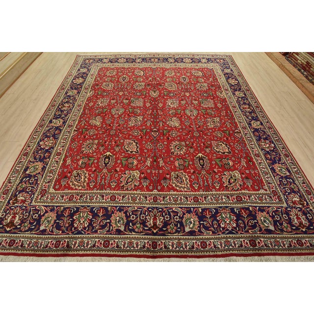 An authentic vintage traditional Tabriz rug hand-knotted with fine wool and natural dyes. This oriental rug features an...