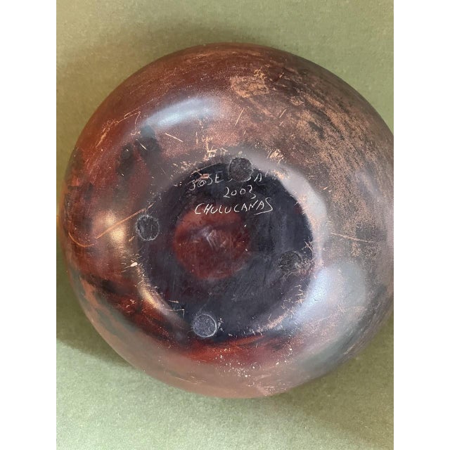 Hand thrown and decorated pottery vase with a warm and wonderful glaze and hand painted decoration featuring circular...