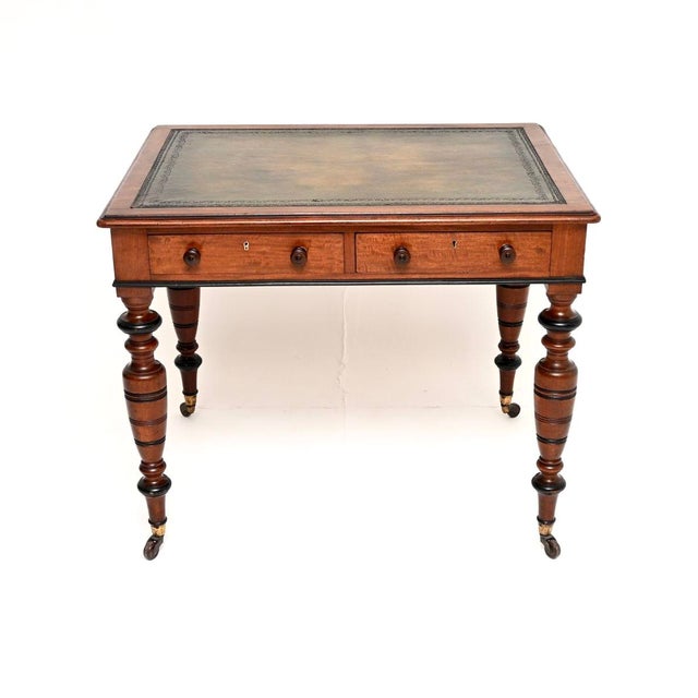 An outstanding antique Victorian writing table / desk. This was made in England, it dates from around the 1880-1890...