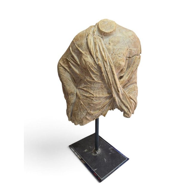 Elegant Greek-style bust sculpture created during the second half of the 20th century, inspired by classical antiquity and...