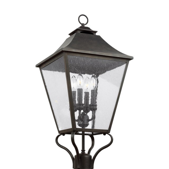 The Sean Lavin Galena four light outdoor post top in sable creates a warm and inviting welcome presentation for your...
