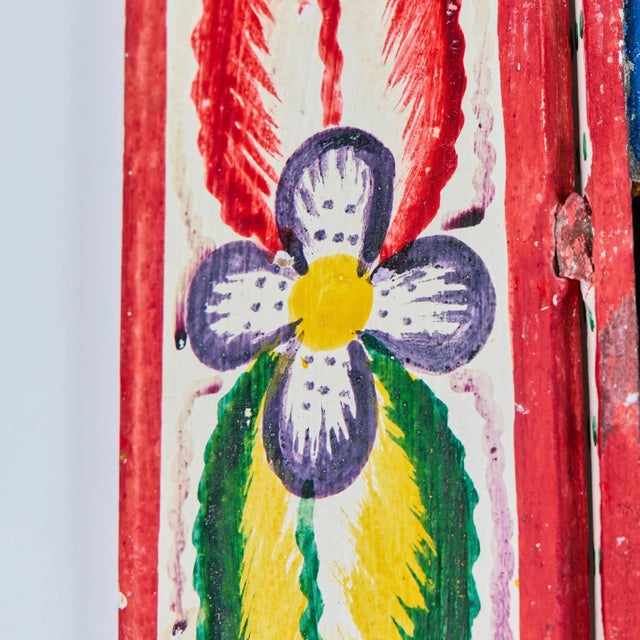 Peruvian retablo purchased from the Evelyn Ackerman estate. This colorful piece features two hinged doors with floral...