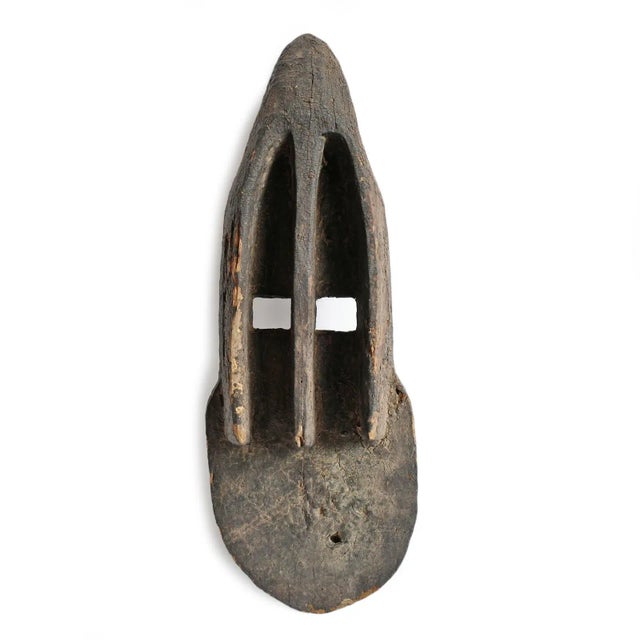 Authentic vintage old Dogon Mali mask with traditional geometric shaped eyes and top horn. Original patina and signs of...