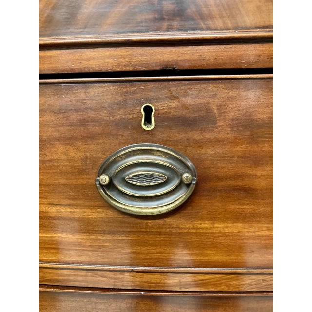 A lovely 19th century English chest of drawers, hand-sourced in England. Crafted from fine mahogany, this piece showcases...