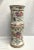 A tall English Adams Lowestoft vase in vibrant floral pinks, purple, gold and green. The hand-painted porcelain vase has a...