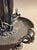 Unmarked, Victorian era silverplate base with handpainted trumpet glass center. Silverplate base shows one side has a...