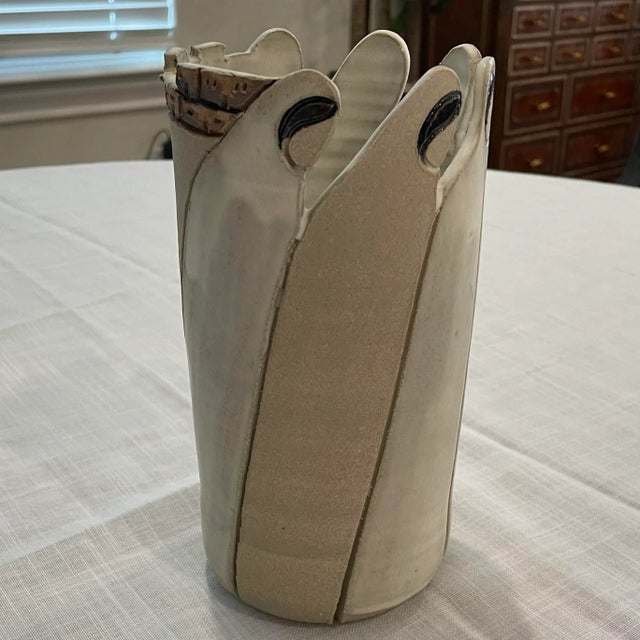 This is a mission style pottery vase. Handcrafted and signed by Texas artist Nancy Dye.