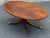 Beautiful regency style coffe table circa late 20th century. Features a striking flame Mahogany top with banded inlay...