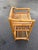 Frank Style three-level rattan book self with a hand-woven rice mat shelf on top and decorative stick rattan backplate...