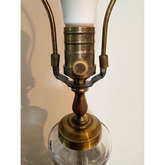 Elegant vintage Wildwood table lamp featuring a substantial clear cut-crystal body decorated with an intricate wheat and...