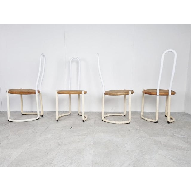 Italian metal postmodern or Bauhaus inspired design dining chairs with white lacquered metal tubular frames and beech wood...