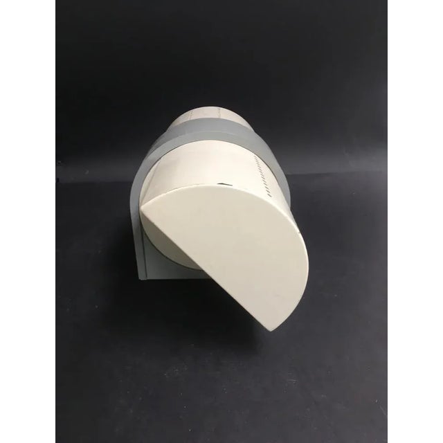 Single wall lamp by Artemide Opalina model; working. The pavilions are revolving. Has some signs of time. 2 lampholders...