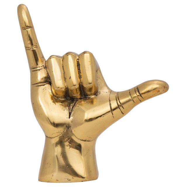 This striking brass sculpture is an unexpectedly chic way to add interest to any decor. Handcrafted of brass with a gently...