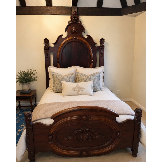 Beautiful antique Victorian walnut bed featuring hand-carved acorn and oak leaf motifs throughout the headboard,...