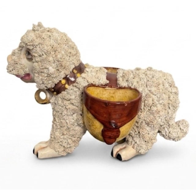 An exceptionally rare and whimsical piece of Mid-Century Italian ceramics, this vintage hand-crafted faience figurine...