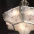 This rare and special Art Deco chandelier features six frosted relief glass panels with a center coupe all in a highly...
