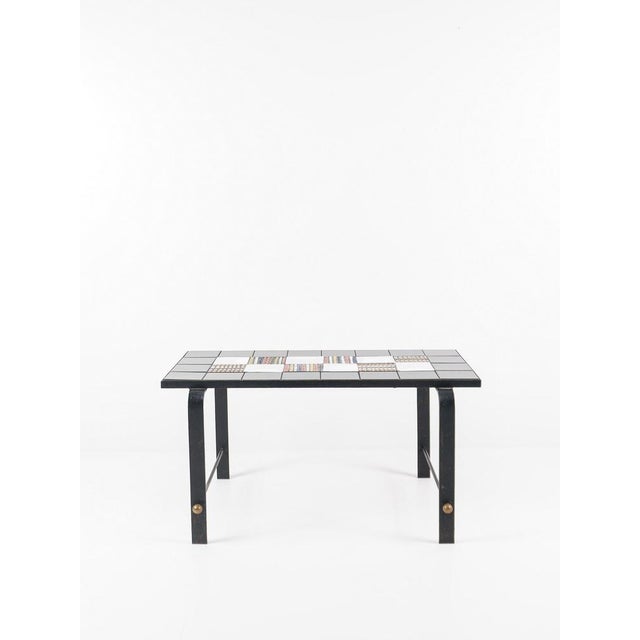 Coffee table france, circa 1950 metal & ceramic h: 52 cm / w: 82 cm / d: 50 cm excellent overall condition. Some signs of...