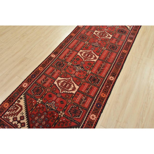 An authentic, vintage, traditional, tribal Zanjan runner hand-knotted with fine wool and natural dyes. This oriental rug...