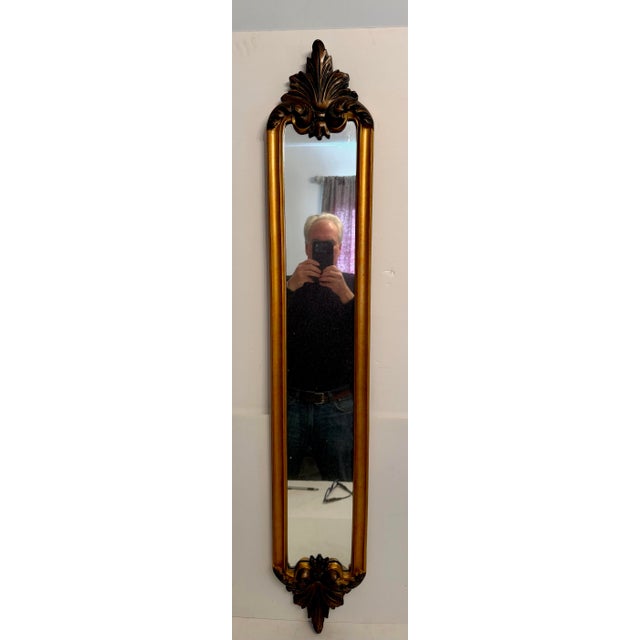 Long and Narrow Bombay Company Pair of Mirrors with gilt finish. Can be hung vertically or horizontally with hangers on...