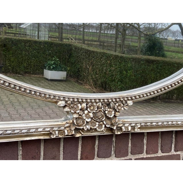 A striking late 20th-century Italian Baroque-style wall mirror, artisan-crafted from solid beechwood and finished in an...