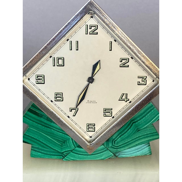 This strikingly handsome, diminutive Swiss clock (it's five inches tall) might be considered "jewelry for the home." The...