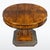 An elegant round Art Deco gaming table featuring beautifully grained walnut veneer and refined craftsmanship typical of...