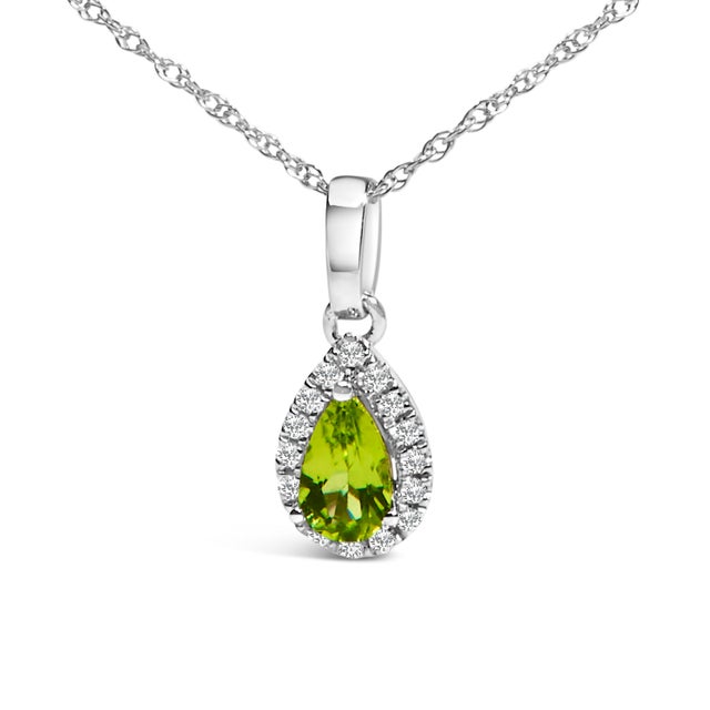 Drape elegance around your neck with this enchanting 10K white gold pendant necklace, where a luscious pear-shaped green...
