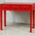 This is a mid-century Chinese export red lacquered altar style console table. The piece is lacquered hardwood with three...