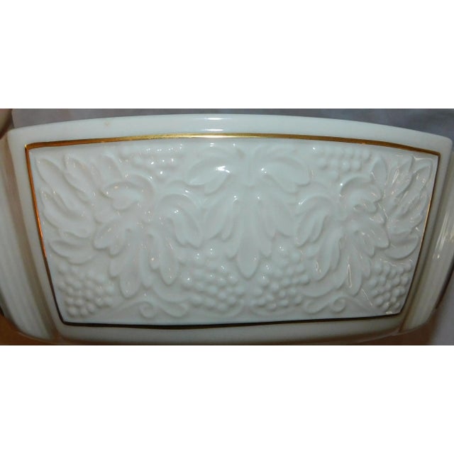 Lenox porcelain bowl with 24k gold trim. Paneled sides with leaf decoration