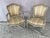 Pair of French Louis XV Style Fauteuil Armchairs. Armchairs are hand-crafted with flowing Rococo lines, and feature a...