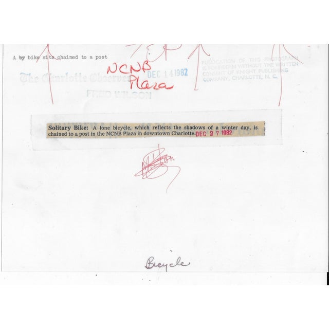 1982 black and white photograph of a bicycle in NCNB Plaza in downtown Charlotte. Publicaton information on the back....