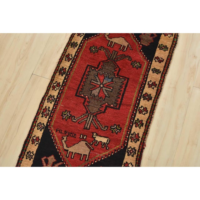 An authentic vintage tribal Malatya rug hand-knotted with fine wool and natural dyes. This nomadic oriental rug features a...