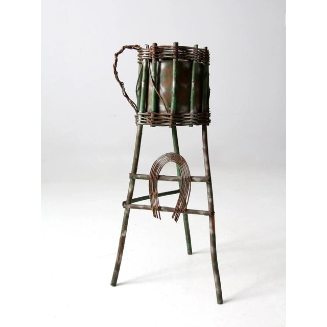 This is an antique folk art plant stand. The Adirondack style twig planter stand features splay willow legs with a...